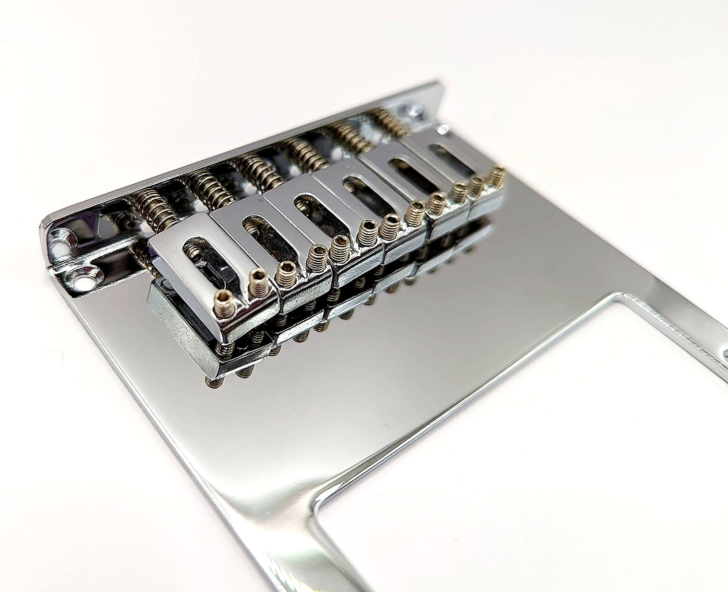 Telecaster chrome saddles on a guitar bridge