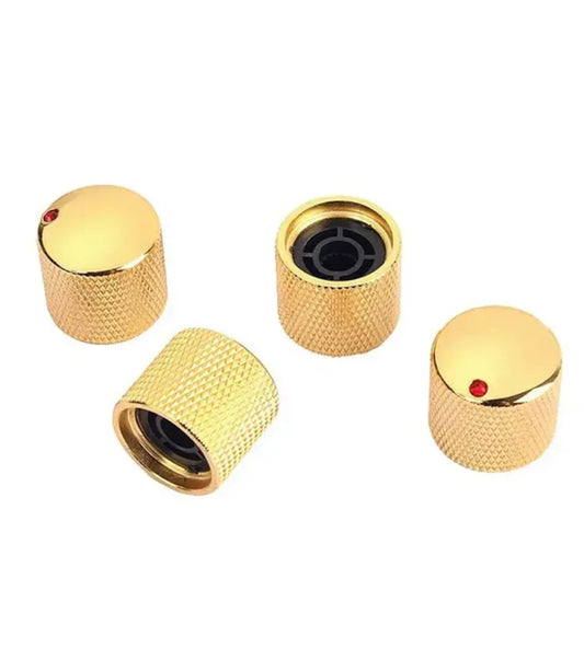 Gold electric guitar volume knobs